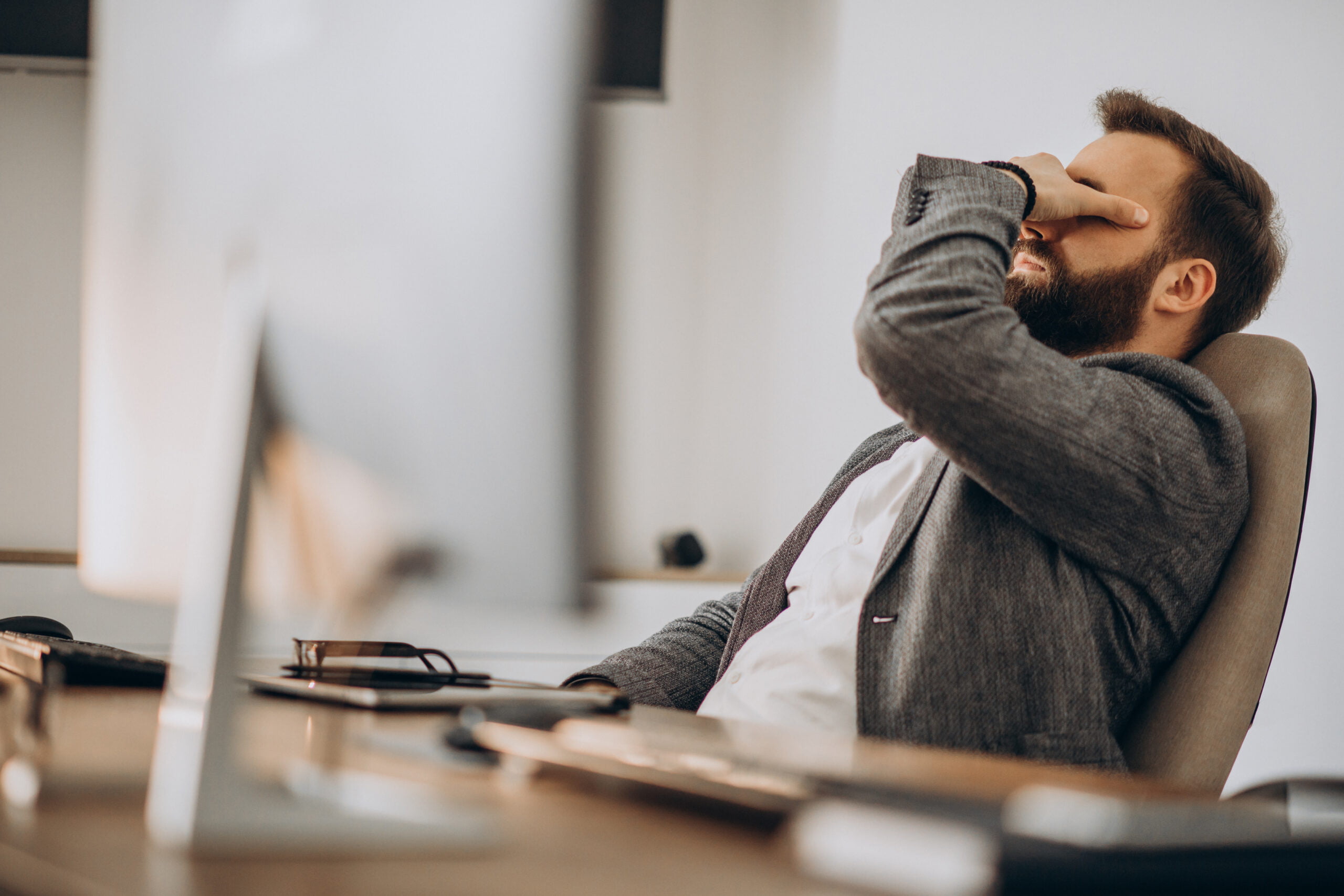 business man feeling the effects of vitamin b12 deficiency