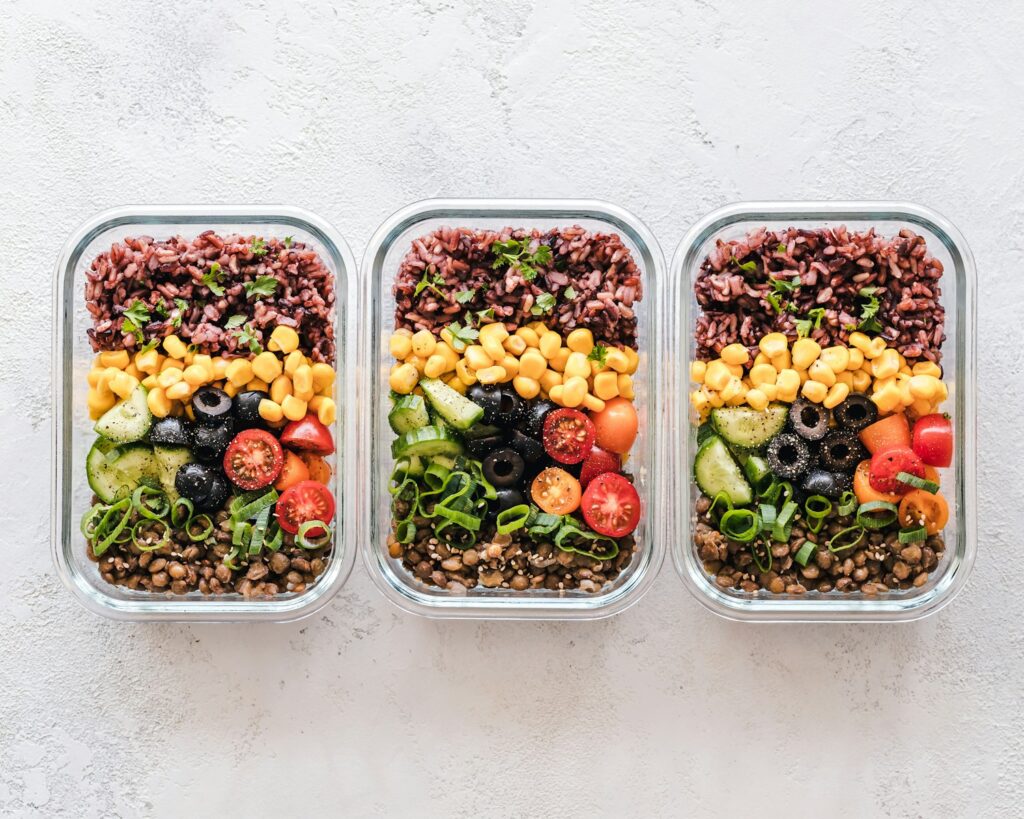 portioned healthy foods in separate 3 containers for a volumetrics diet