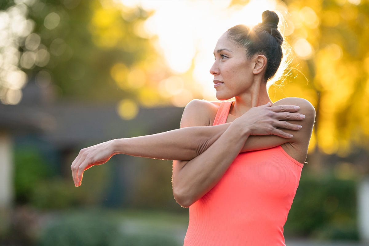 woman stretching after starting to take probiotics